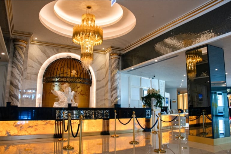 Counter of a luxurious hotel with golds, black, and white colours
